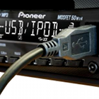 Pioneer car radio with 'USB iPod' on display and USB connection cable plugged in