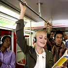 young people wearing headphones, subway, public transportation